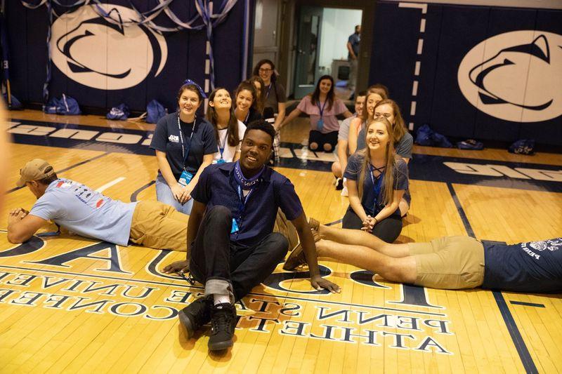 Students sitting in gymnasium