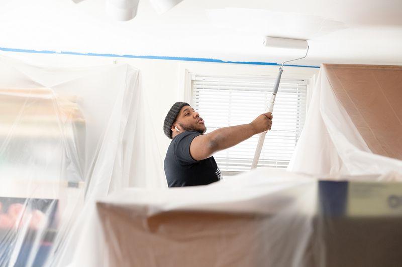 Student painting ceilings