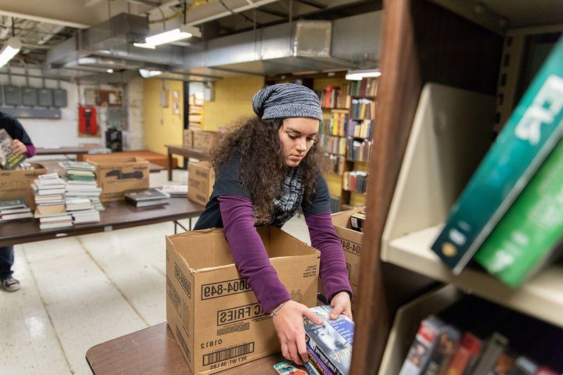 Student moves books