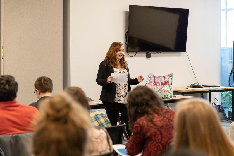 Woman speaks to group