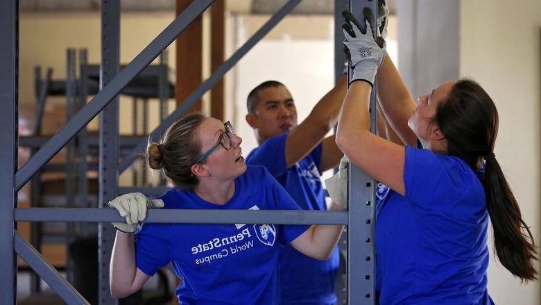 World Campus student volunteers work on building