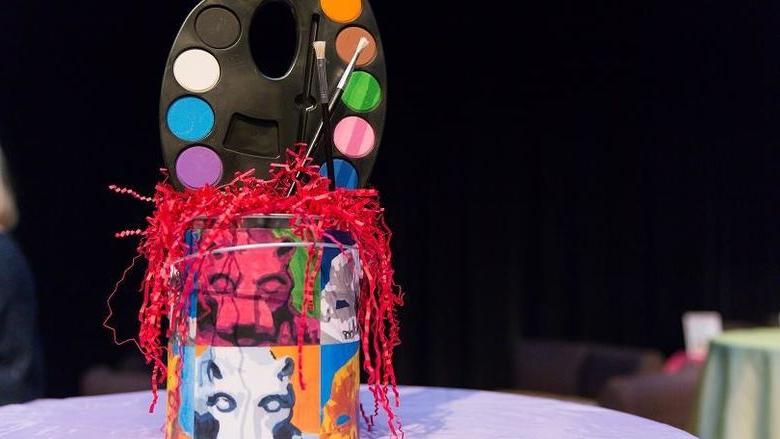 Paint can centerpiece on table at the 2018 Off the Wall pARTy