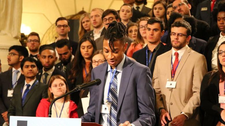 Student speaks at podium