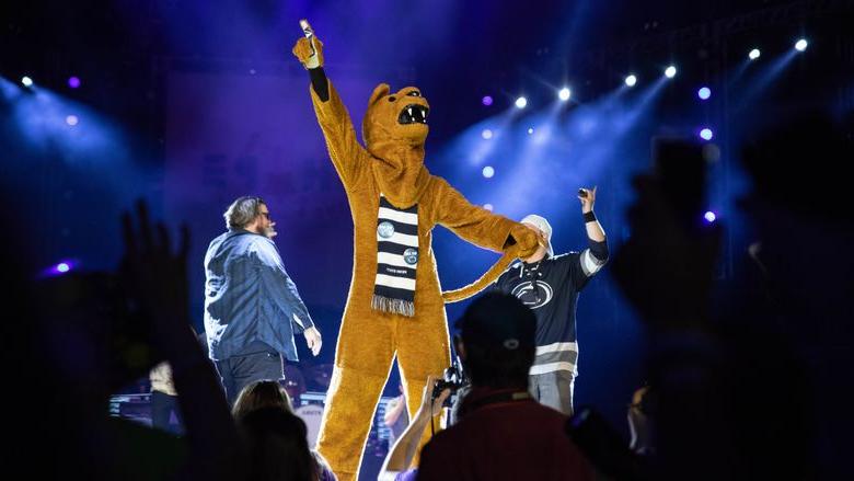 Nittany Lion mascot stands on stage