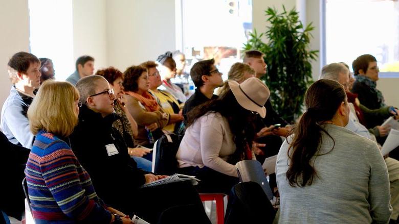 Participants at an entrepreneurial workshop look on