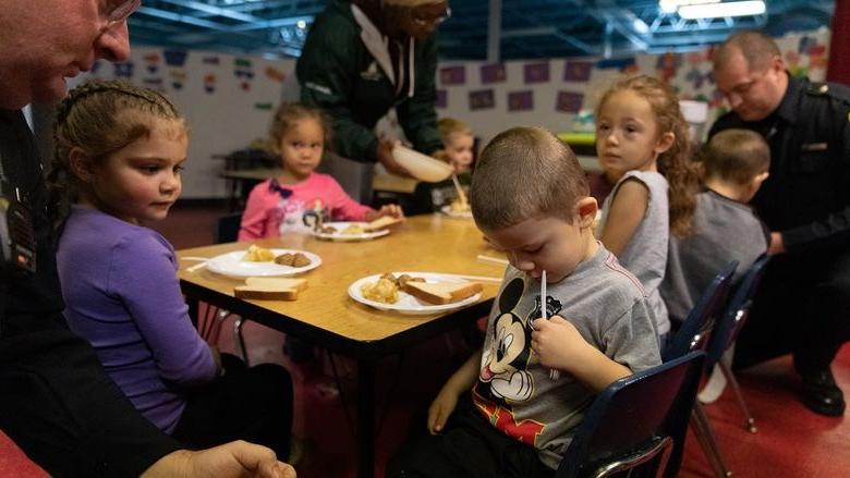 Police officers visit children in childcare